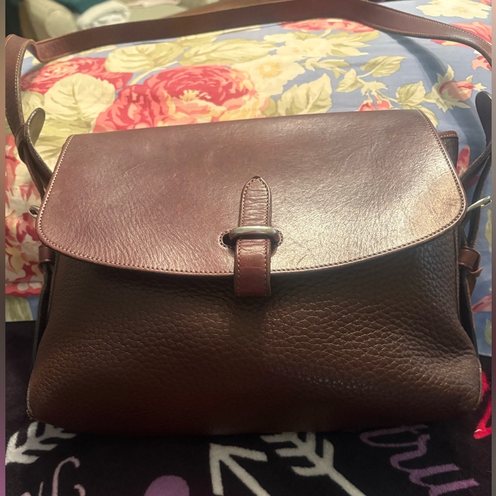 Vintage Dooney & Bourke All Brown Leather with hard ware in silver. Lovely.